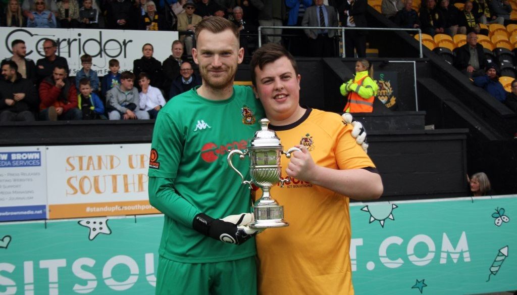 The 2021/22 Southport Supporters Player Of The Year is Cam Mason. Cam was presented with his award on the pitch ahead of the game this afternoon by the organiser of the supporters coach travel this season, Dan Bond