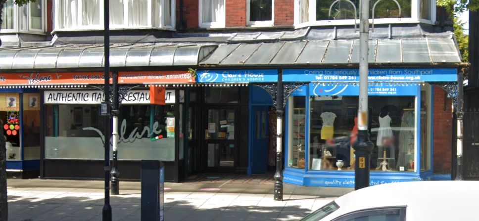 Volare restaurant and the Claire House children's hospice charity shop on Lord Street in Southport