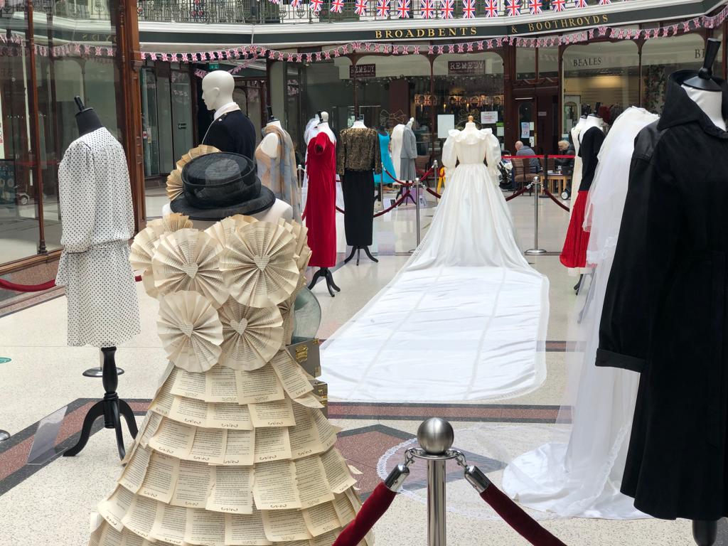The dress created from the pages of a book, designed by Queenscourt Hospice shop manager Heather Abram, on display at Wayfarers Arcade in Southport town centre