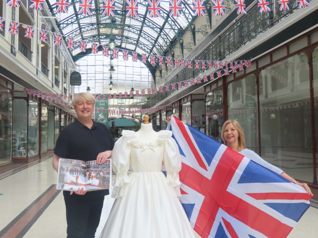 Wayfarers Arcade in Southport town centre has announced the centrepiece of its Jubilee Fashion Exhibition is to be an exact copy of Diana Princess of Wales wedding dress when she married Prince Charles on 29 July 1981, created by Mark Lyon-Taylor (left), with Wayfarers Arcade Centre Manager Yvonne Burns (right). Photo by Andrew Brown Media