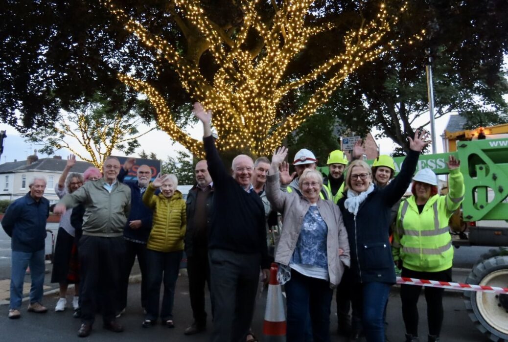 Ainsdale Village in Southport has been lit up with 70,000 new lights thanks to Ainsdale Civic Society and IllumiDex UK Ltd. Members of Ainsdale Civic Society and IllumiDex celebrate the completion of the project. Photo by Andrew Brown Media