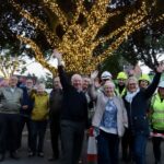 Ainsdale Village in Southport has been lit up with 70,000 new lights thanks to Ainsdale Civic Society and IllumiDex UK Ltd. Members of Ainsdale Civic Society and IllumiDex celebrate the completion of the project. Photo by Andrew Brown Media