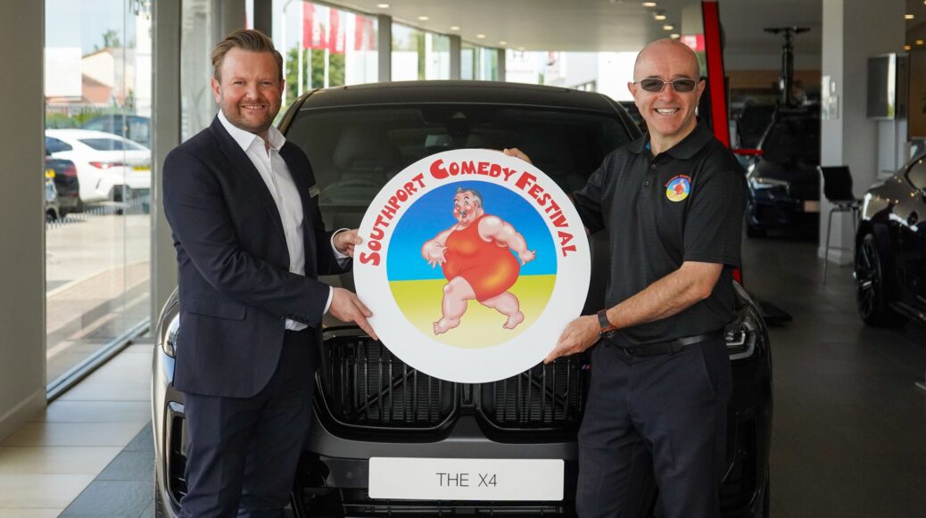 Matthew Hall of Halliwell Jones BMW (left) and Southport Comedy Festival Director Brendan Riley (right)
