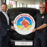 Matthew Hall of Halliwell Jones BMW (left) and Southport Comedy Festival Director Brendan Riley (right)