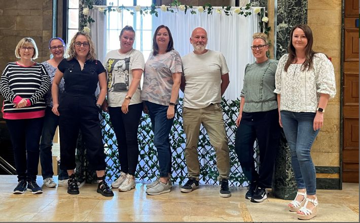 Employees from Access Point in Southport are celebrating the firm's 25th birthday buy walking from Wigan to Southport to raise money for Queenscourt Hospice