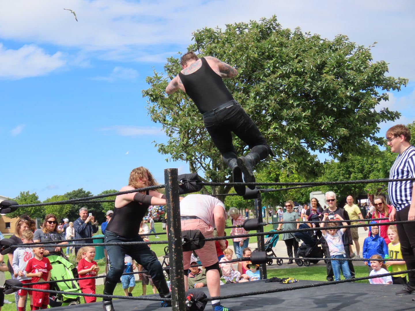 Wrestling at The Far Away Land Festival at Victoria Park in Southport. Photo by Andrew Brown Media