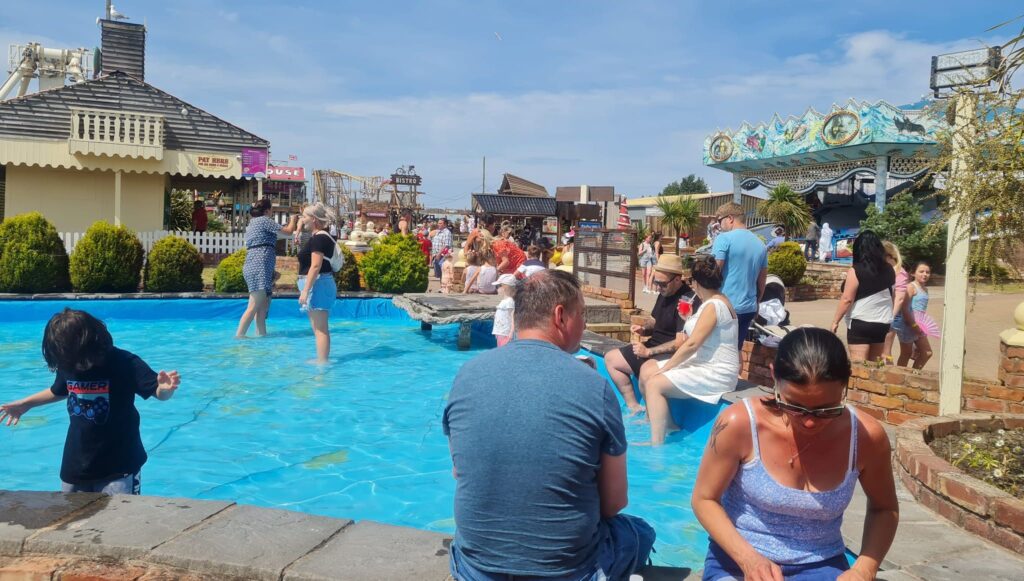 People cool off in the water feature at Southport Pleasureland. Photo by Norman Wallis
