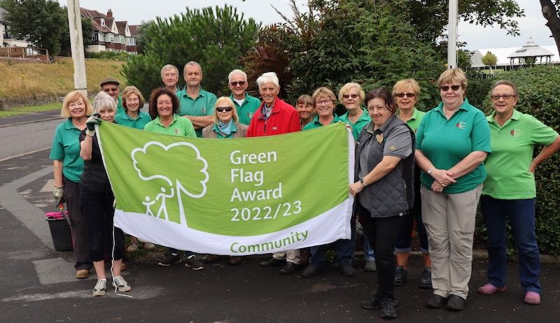 Rotten Row in Southport is celebrating its 100th anniversary. The herbaceous border is largely maintained by volunteers from the Friends Of Rotten Row. They are pictured here with their Green Flag Award