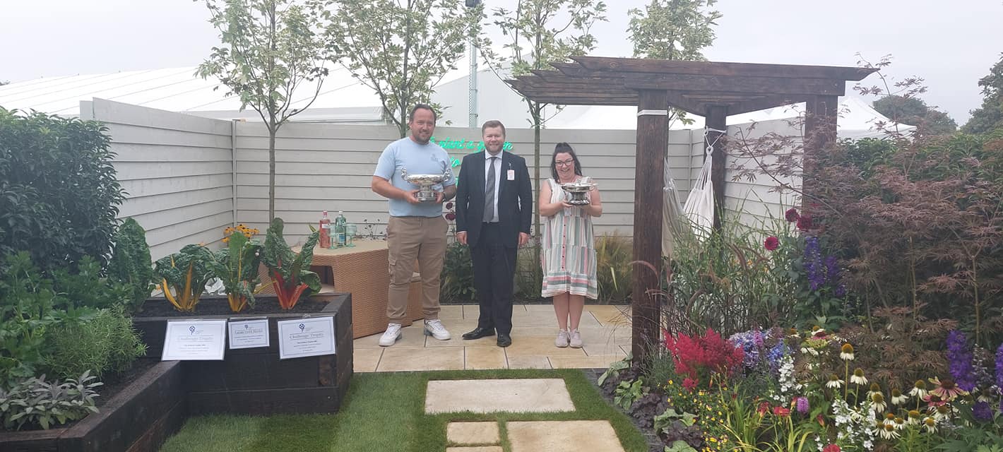 Cutting Edge Garden Services in Southport has been awarded three trophies at Southport Flower Show 2022. Tom Fletcher with Southport MP Damien Moore