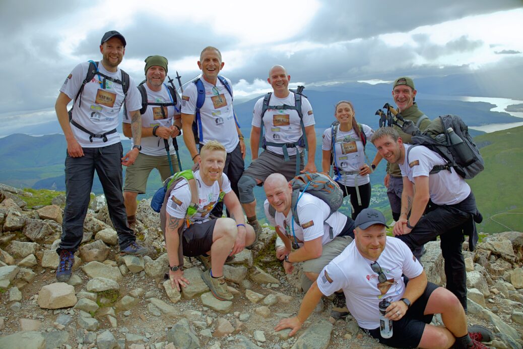 Eleven mad men and one mad woman have raised over £9,000 for Queenscourt Hospice - by successfully climbing the three highest mountains in England, Wales and Scotland
