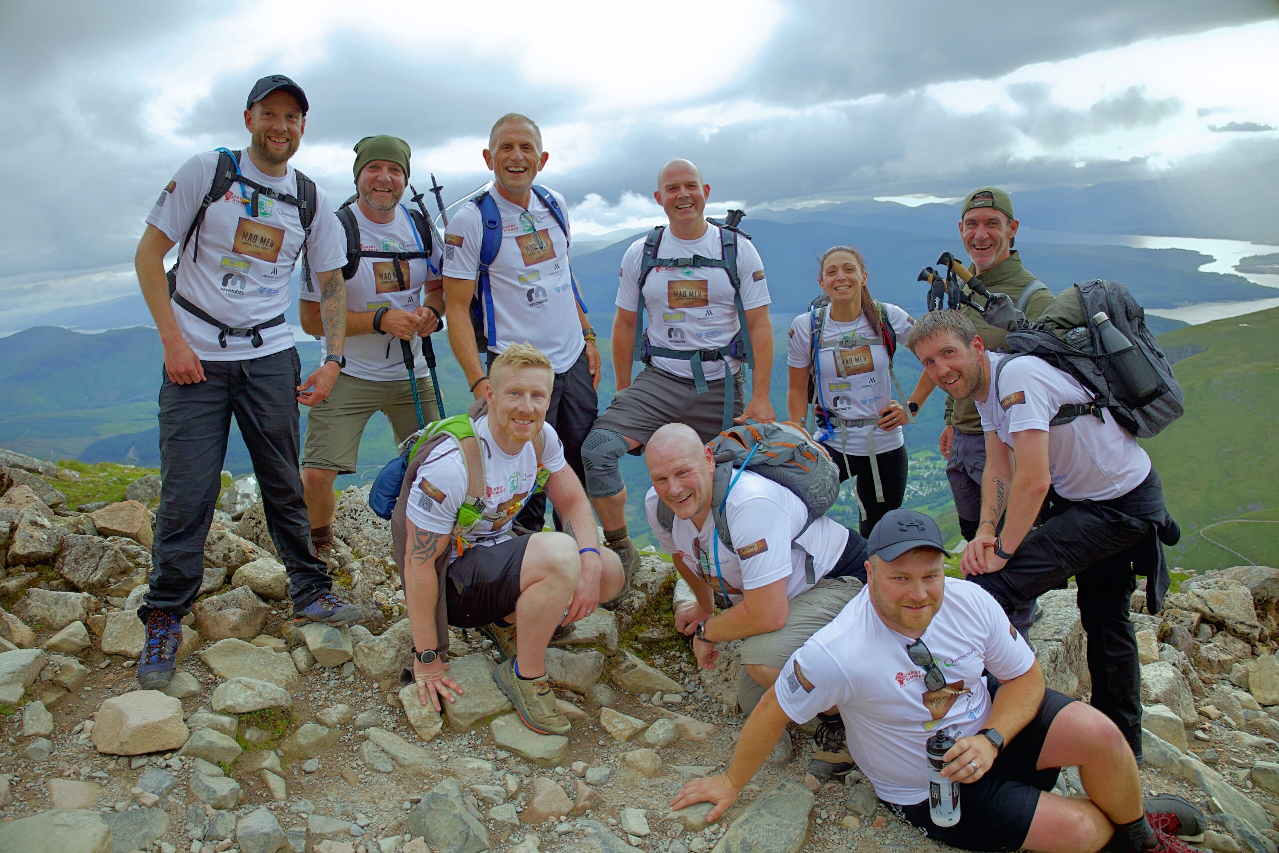 Eleven mad men and one mad woman have raised over £9,000 for Queenscourt Hospice - by successfully climbing the three highest mountains in England, Wales and Scotland