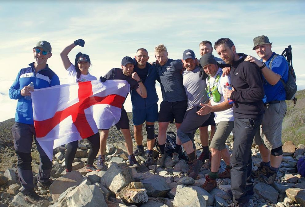 Eleven mad men and one mad woman have raised over £9,000 for Queenscourt Hospice - by successfully climbing the three highest mountains in England, Wales and Scotland