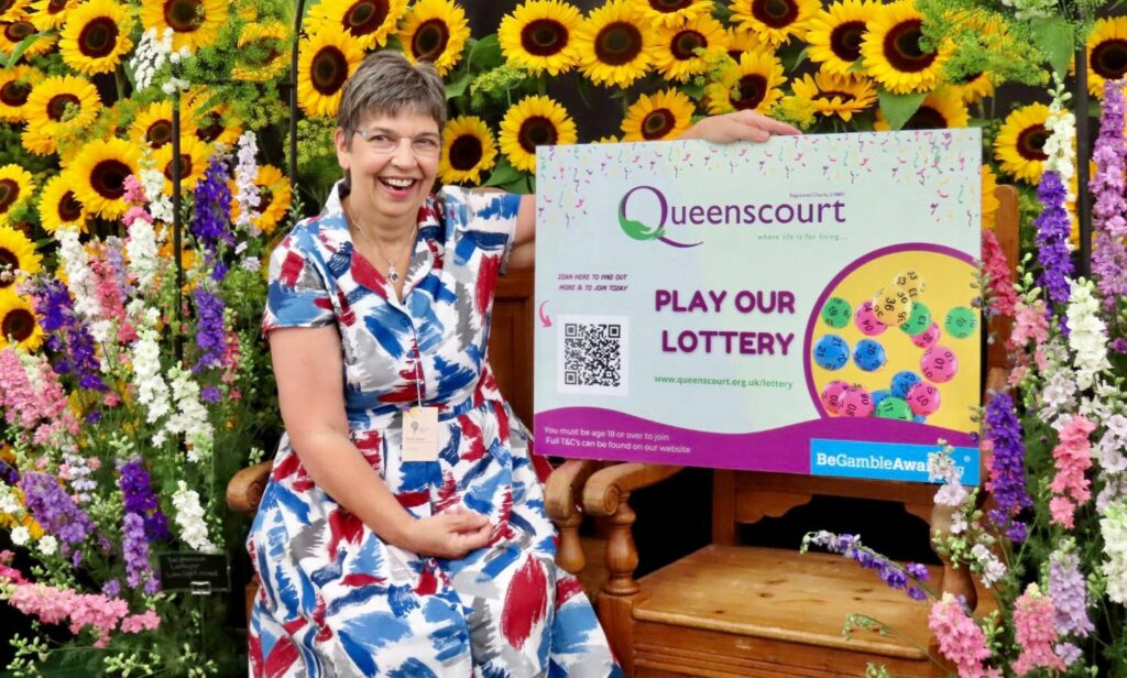 Dr Karen Groves MBE, who founded Queenscourt Hospice, promotes the Queenscourt Lottery. Dr Groves is pictured at the 2022 Southport Flower Show, which she was invited to officially open. Photo by Andrew Brown Media