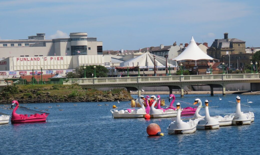 The Marine Lake in Southport, including Silcock's Funland, Southport Pier and Herbert Silcock's Carousel. Photo by Andrew Brown Media