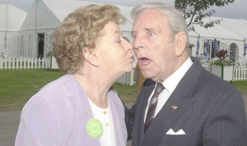 Actress Jean Alexander gives Sir Norman Wisdom a kiss at the Southport Flower Show 2002