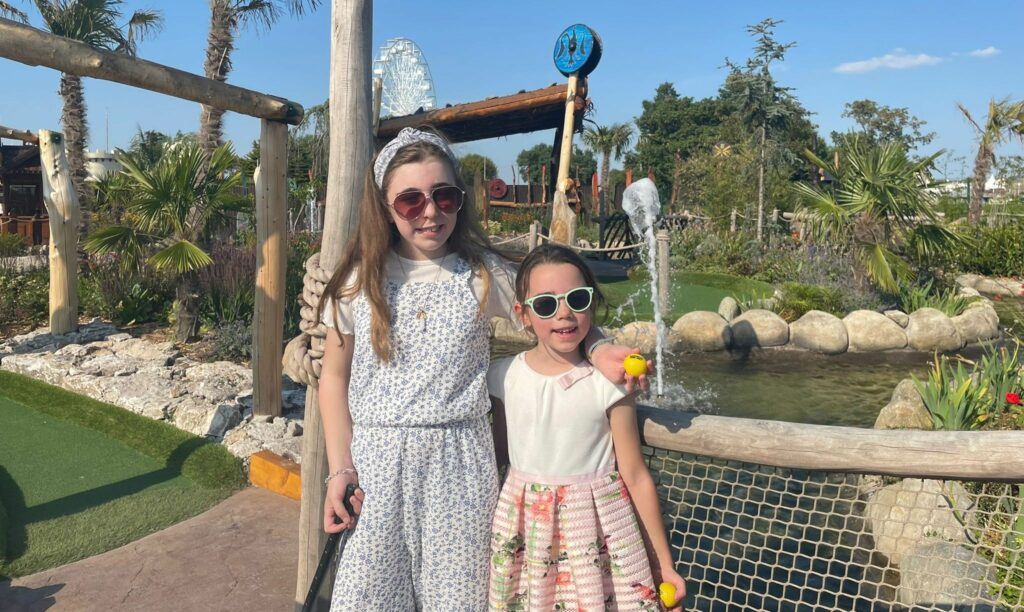 Francesca and Amelie Brown enjoy the Viking Adventure Golf course at Southport Pleasureland. Photo by Claire Brown of Andrew Brown Media