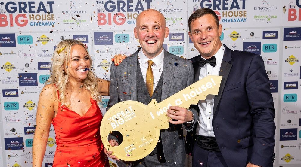 L-R Caroline Taylor, Head of Income, Marketing and Communications at Derian House Childrens Hospice, Charles Maughan (winner of the Great Big House Giveaway), Paul Jones, Managing Director of Kingswood Homes