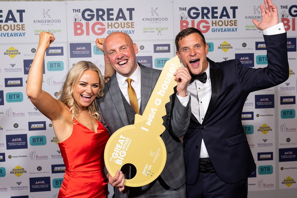 L-R Caroline Taylor, Head of Income, Marketing and Communications at Derian House Childrens Hospice, Charles Maughan (winner of the Great Big House Giveaway), Paul Jones, Managing Director of Kingswood Homes