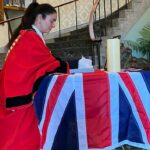 Mayor of Sefton Cllr Clare Carragher signs the Book of Condolence for Queen Elizabeth II at Bootle Town Hall