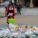 Mayor of Sefton Cllr Clare Carragher lays a floral tribute to Queen Elizabeth II in the Town Hall Gardens in Southport. Photo by Andrew Brown Media