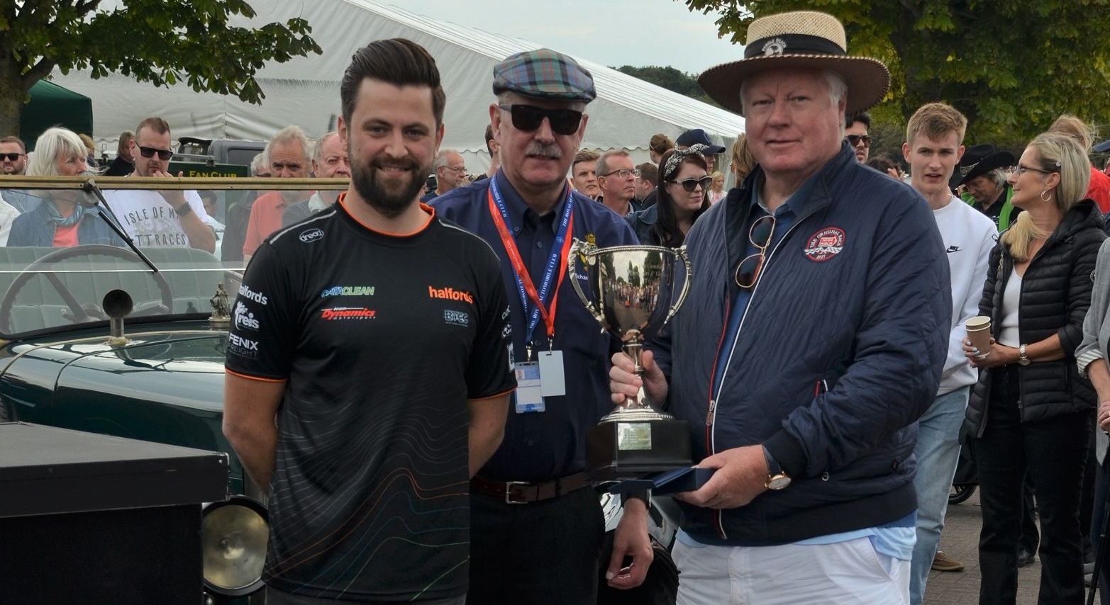 Daniel Rowbottom presents Brian Ellis with the Best in Show award at Southport Classic and Speed at Victoria Park in Southport. Photo by Stephen Mosley