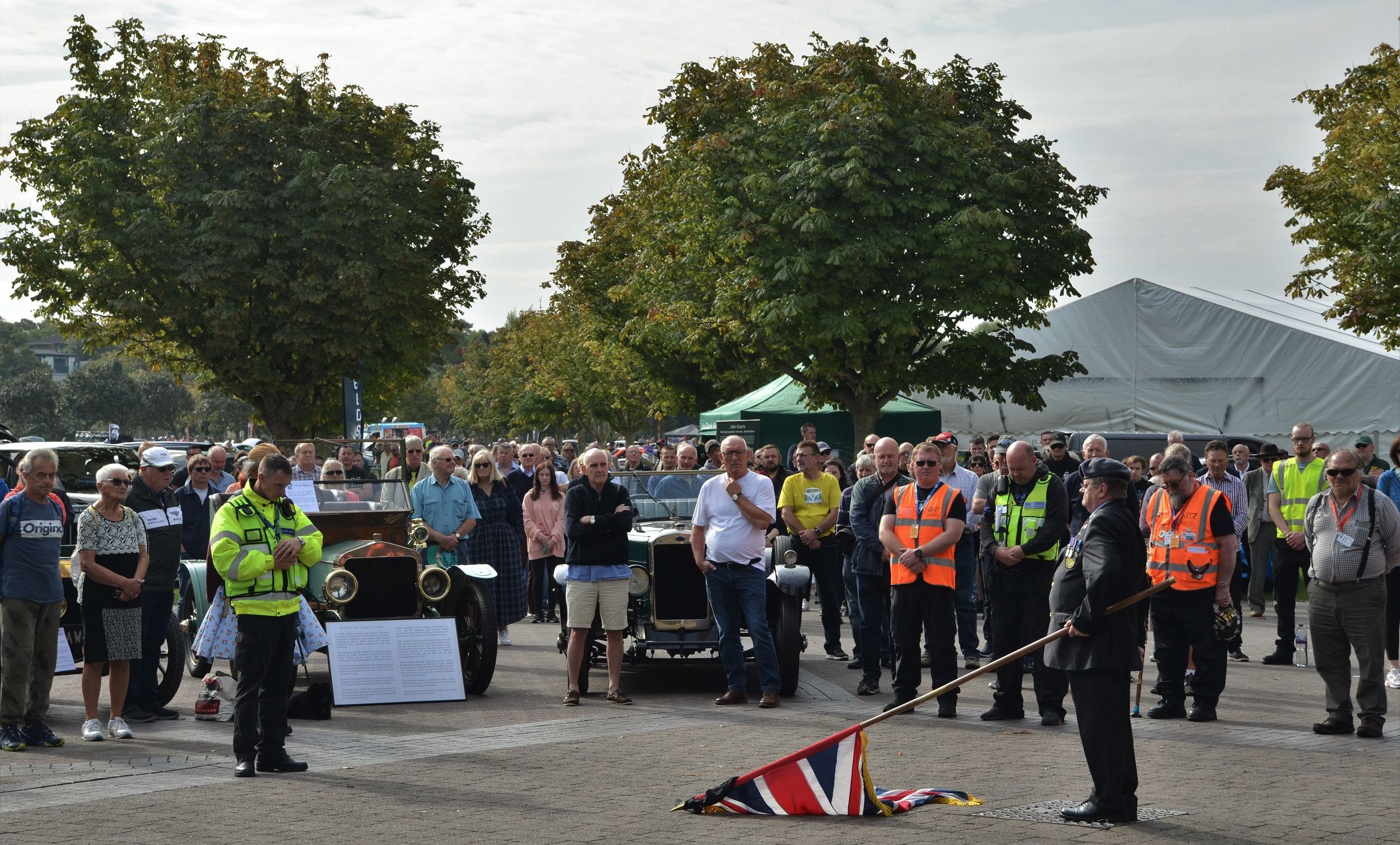 Crowds hold a two minutes' silence for Her Majesty Queen Elizabeth II at Southport Classic and Speed at Victoria Park in Southport. Photo by Stephen Mosley