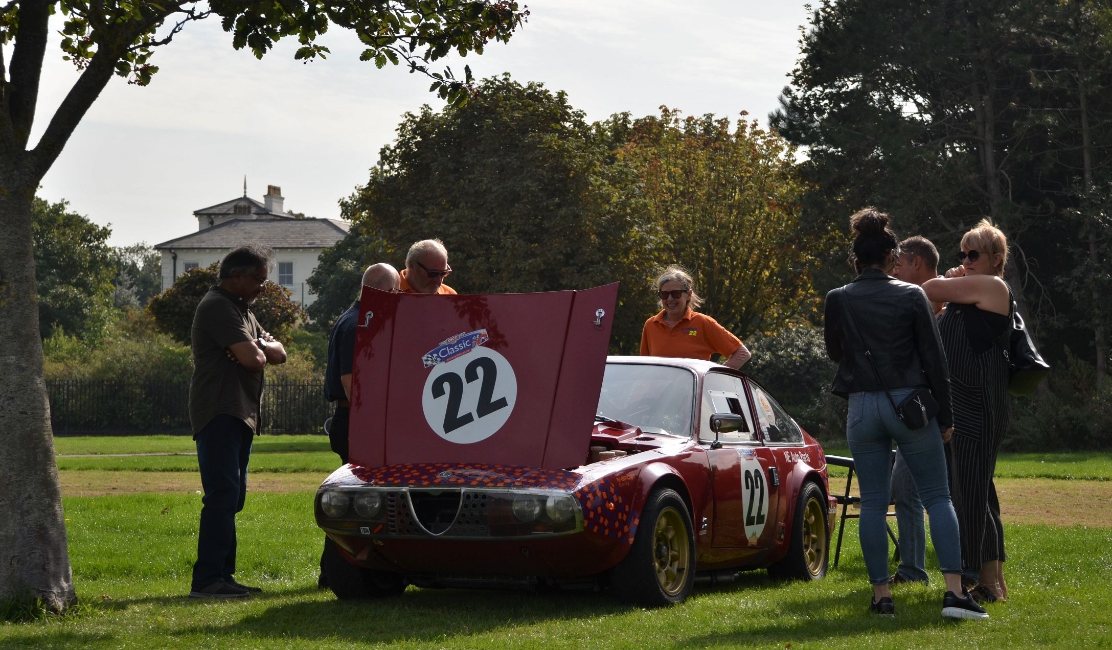 An Alfa Romeo Junior Zagato of Nick Edmond attracts interest at Southport Classic and Speed at Victoria Park in Southport. Photo by Stephen Mosley