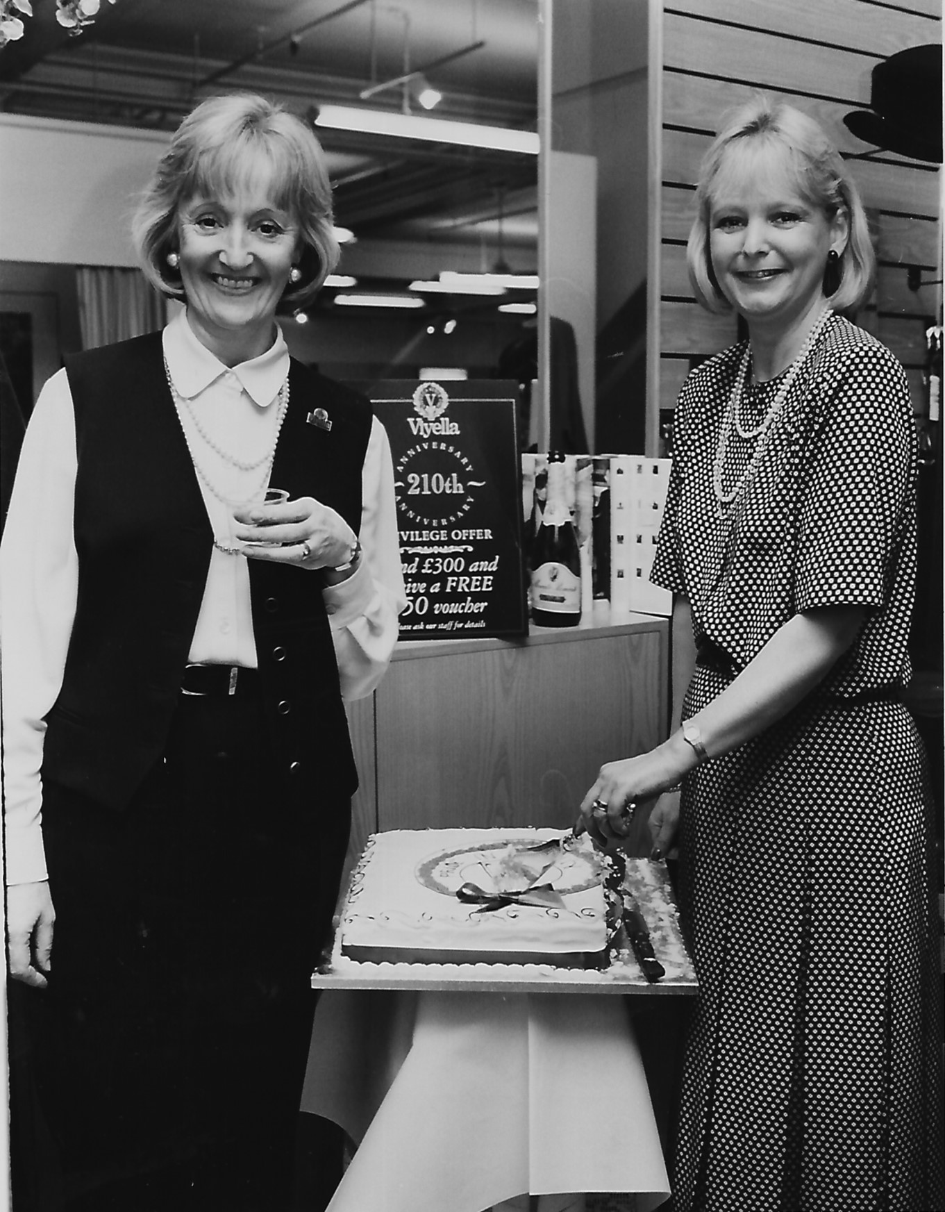 Southport in November 1994. These two colleagues celebrates the 210th Viyella anniversary with some cake