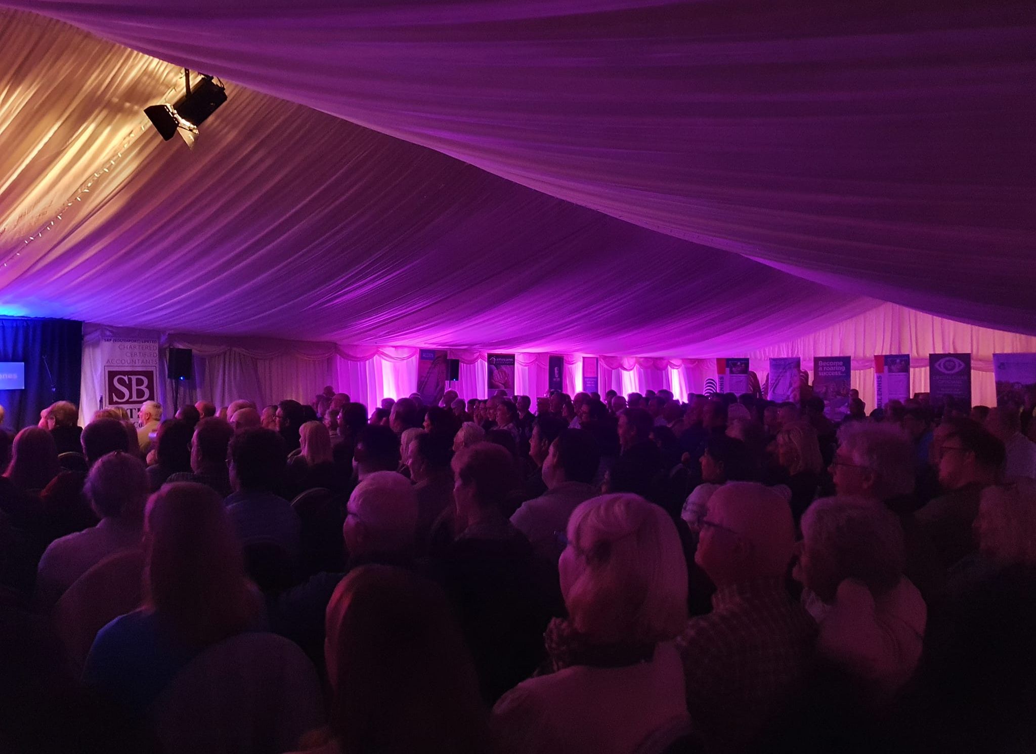 Guests enjoy a gig in an Elite Marquees marquee at Southport Comedy Festival 2022