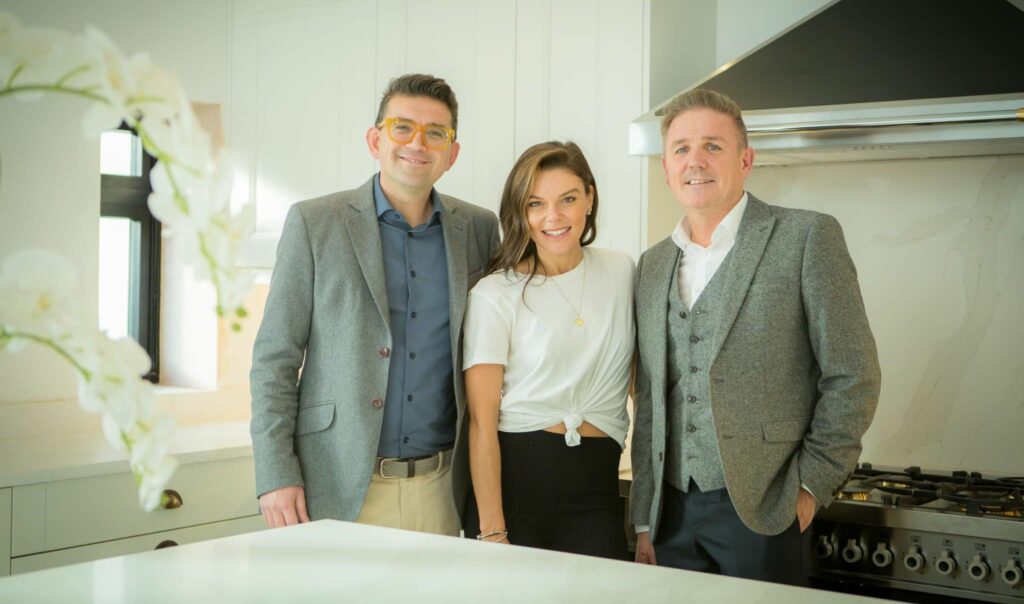 Coronation Street star Faye Brookes (centre) in her ner kitchen with Birkdale Kitchen Co. owners Neil Gokcen (left) and Stephen Dunne (right)