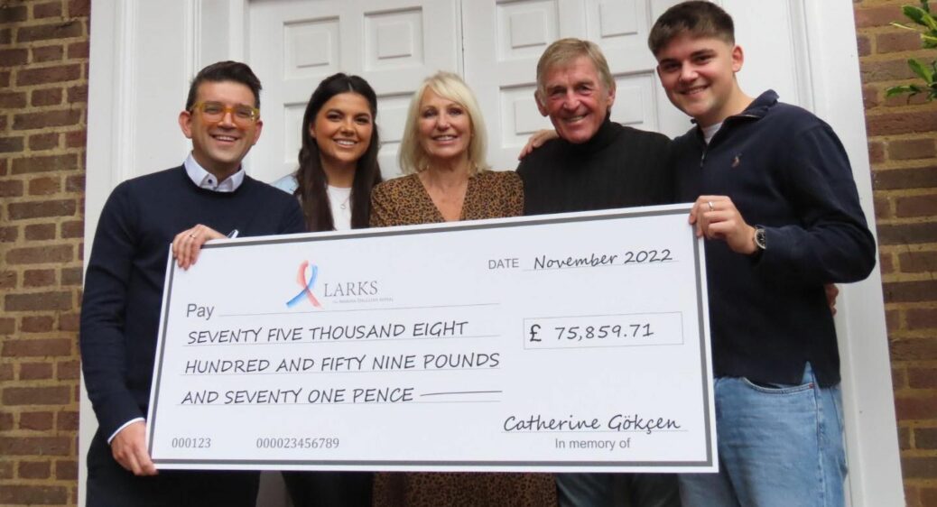 Neil Gokcen (left) with children Eve (second left) and Tom (right) presented a cheque for £75,859.71 to Sir Kenny Dalglish and Marina Dalglish with the money going to the Larks at the Marina Dalglish Appeal. Photo by Andrew Brown Media