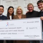 Neil Gokcen (left) with children Eve (second left) and Tom (right) presented a cheque for £75,859.71 to Sir Kenny Dalglish and Marina Dalglish with the money going to the Larks at the Marina Dalglish Appeal. Photo by Andrew Brown Media