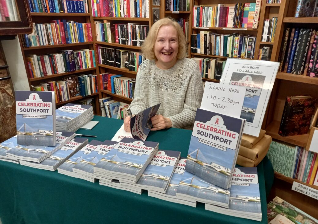 Margaret Brecknell signs copies of her book celebrating Southport in Broadhurst's bookshop in Southport