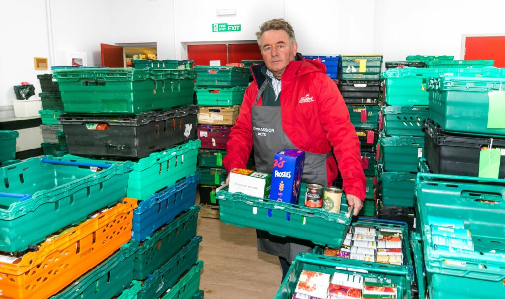 Southport Pleasureland boss Norman Wallis is giving money and time to ensure local families don't go hungry this Christmas