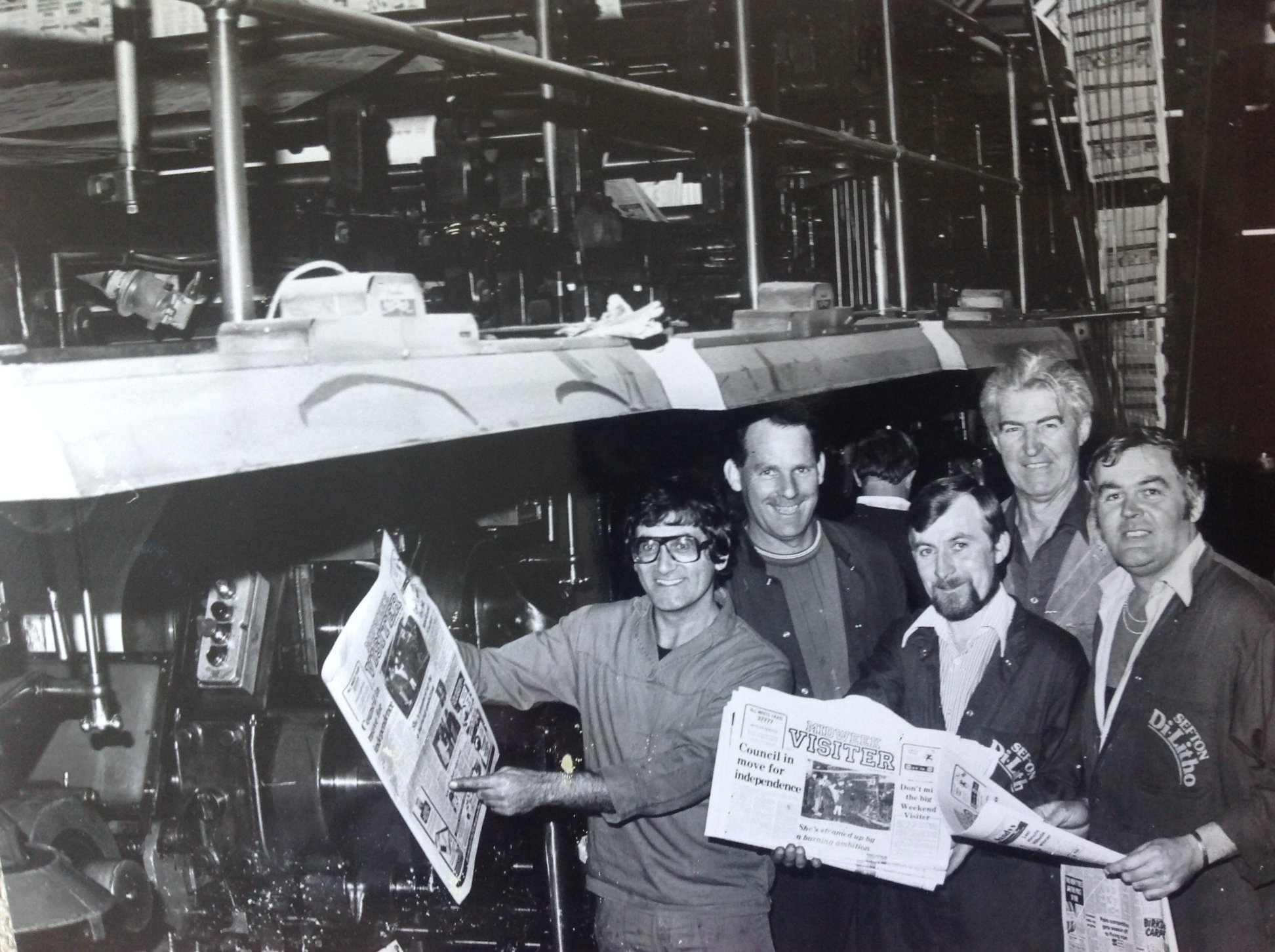 Southport Visiter staff with copies of the newspaper next to the printing press at the Southport Visiter office on Tulketh Street in Southport