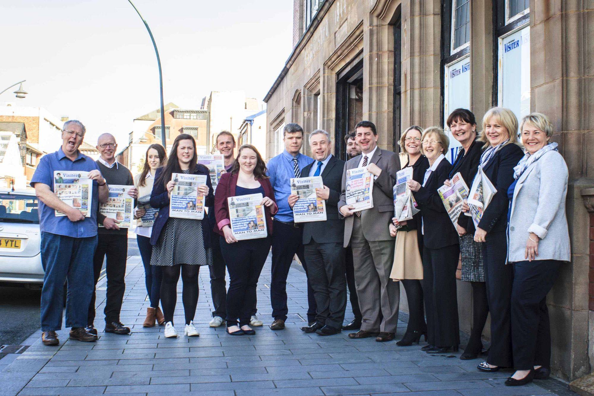 Southport Visiter staff celebrate the newspaper's 174th birthday outside the Southport Visiter office on Tulketh Street in Southport town centre on 4th May 2018