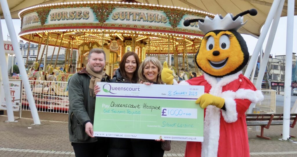 Runners enjoyed the Southport Santa Sprint for Queenscourt Hospice sponsored by Silcock's. Silcocks Operations Manager Serena Silcock-Prince (second left) presented a cheque for £1,000 to Southport MP Damien Moore (left) and Queenscourt Events Fundraiser Dianne Gillespie. Photo by Andrew Brown Media