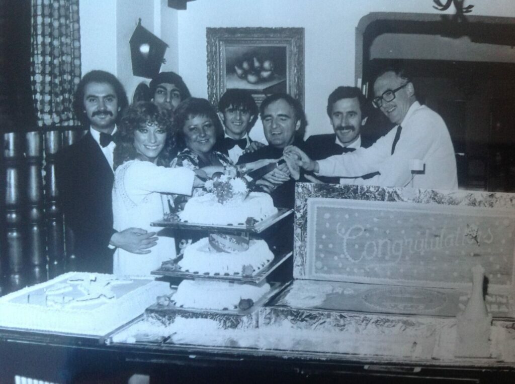 Staff at Casa Italia restaurant on Lord Street in Southport celebrate the venue's third birthday party in September, 1981. The Grossi family, which owned the restaurant for many years, were joined by cartoonist Bill Tidy (right) to cut the cake.