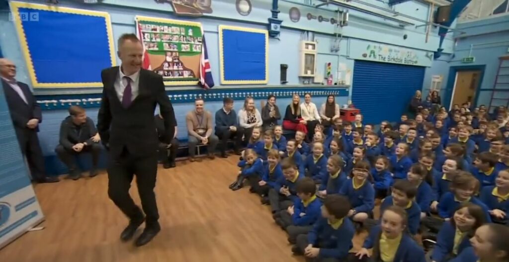 Nick Sheeran, the headteacher at Birkdale Primary School, returned to school for the first time after suffering a cardiac arrest on the last day of term. Photo by BBC Breakfast