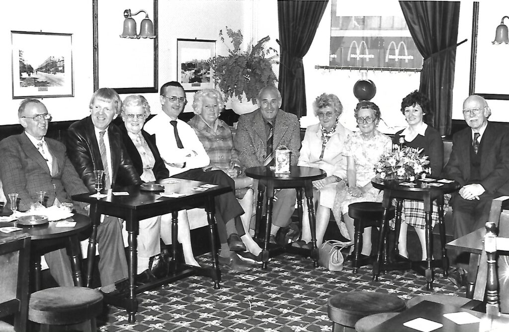 A gathering at The Coronation pub on King Street in Southport town centre in May 1982. In view are the McDonalds signs on the building opposite