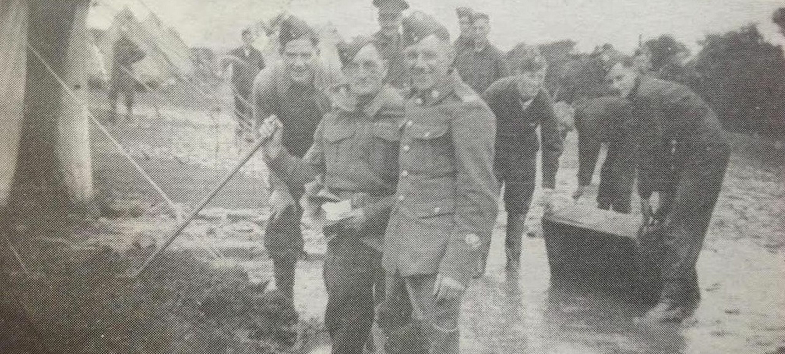 Members of the 538 (Petrol) Company clearing up after a deluge on their camp in the Gower. It was taken just before mobilisation. In the foreground are CSM Joe Bromilow and Sgt Harold Guest. In the far right is Harold Ainscough of Birkdale and David Hayward is in the background right with a shovel. Mr Hayward recalled: "We always left from the Hesketh Arms, Churchtown, when we went anywhere, the landlady was an honorary member of the unit." Photo: David Hayward