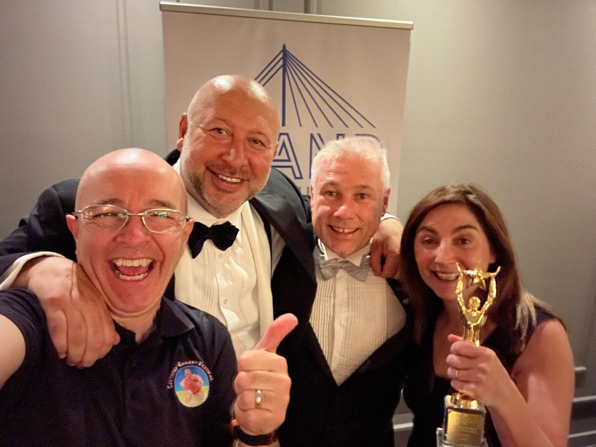 Brendan Riley (left) and Val Brady (right) from Southport Comedy Festival / Big Comedy won the Business In The Community Award at the 2023 Pride Of Sefton Awards. They are pictured with event organisers Andrew Mikhail (second left) and Andrew Brown