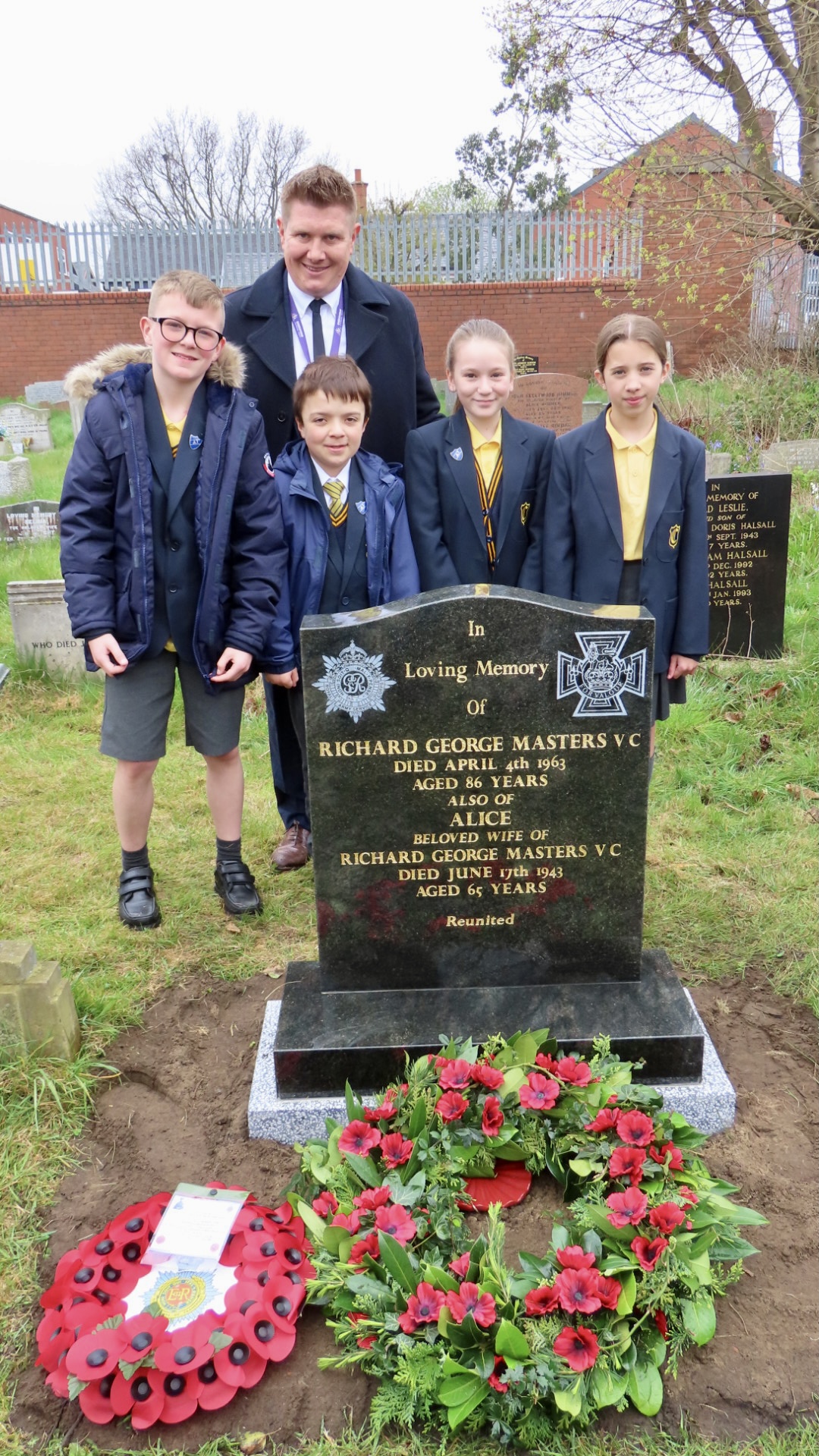 Crowds paid their respects as a new headstone was unveiled in tribute to Private Richard George Masters, from Southport, who was awarded a Victoria Cross when he saved the lives of 200 wounded British Army soldiers on 9th April 1918 during World War One. The delegation from Churchtown Primary School. Photo by Andrew Brown Stand Up For Southport