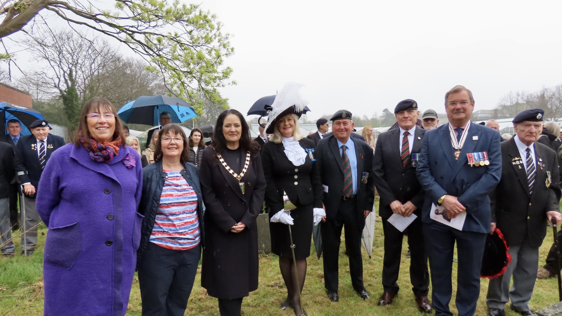 Crowds paid their respects as a new headstone was unveiled in tribute to Private Richard George Masters, from Southport, who was awarded a Victoria Cross when he saved the lives of 200 wounded British Army soldiers on 9th April 1918 during World War One. Judy Masters (left) and Joanne Rich (second left) with Mayor of Sefton Cllt Clare Carragher (third left), High Sheriff of Merseyside Lesley Martin-Wright (fourth left), event organiser Rolan Sutton (fifth left), and other dignitaries. Photo by Andrew Brown Stand Up For Southport