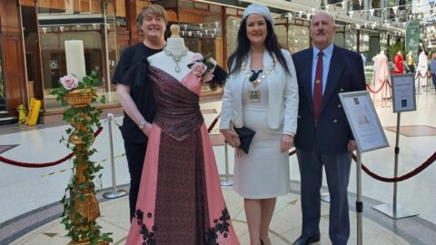 Mayor praises talented fashion designer as vintage fashion exhibition opens at Wayfarers Arcade