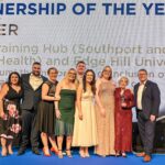 Sefton Training Hub (Southport and Formby Health) and Edge Hill University have won the Partnership Award at the 2023 Student Nursing Times Awards. L to R: Award presenter, Richie Williams, Emma Galley, Denise Dutton, Andrew Jopson, Kim Wareing, Jess Lea, Maggi Bradley and Steve Ford