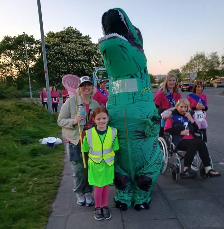 Joanne Caddy and Amanda Bradley were inspired by Jurassic Park to raise funds for Queenscourt Hospice by walking 10 kilometres through the streets of Southport - dressed as an 8ft tall Tyrannosaurus Rex dinosaur and a Jurassic Park Ranger!