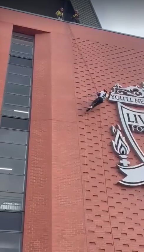 John Blackhurst, 82, has completed a 100ft abseil at Liverpool Football Clubs Anfield stadium to raise vital funds for Queenscourt Hospice in Southport
