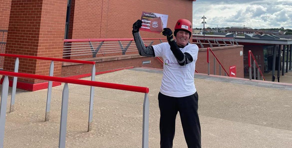 John Blackhurst, 82, has completed a 100ft abseil at Liverpool Football Clubs Anfield stadium to raise vital funds for Queenscourt Hospice in Southport