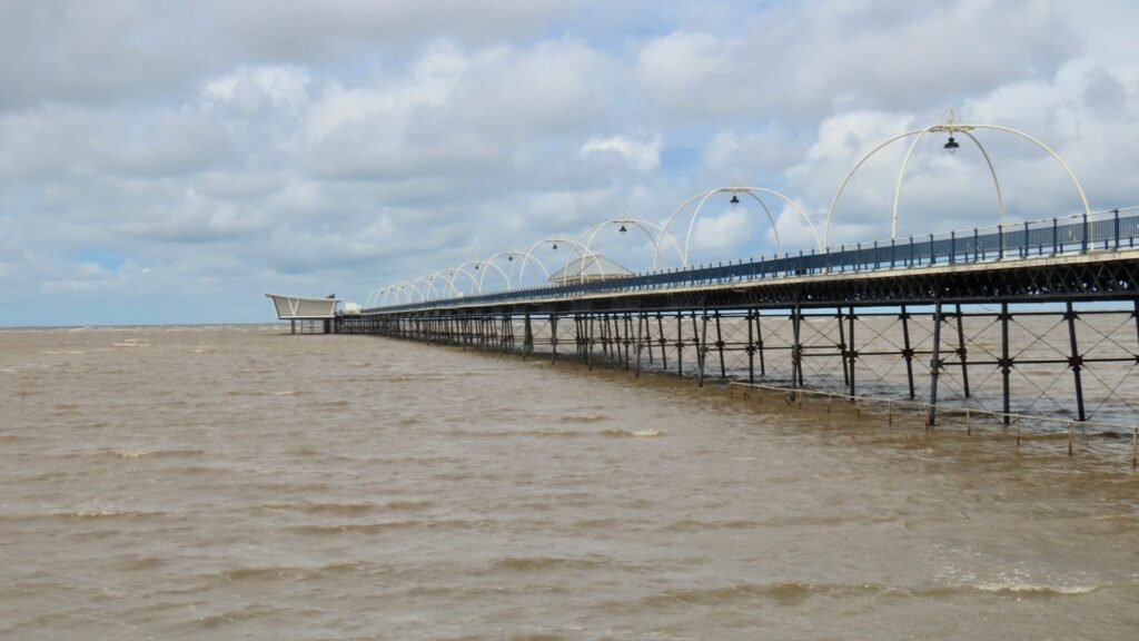 A scenic photo of Southport Pier and Southport Beach. Photo by Andrew Brown Stand Up For Southport